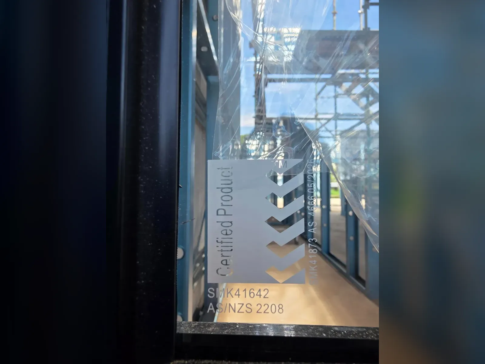 AS/NZS 2208 certified product label on the glazing of a Clearview, Adelaide project, marked SMK41642