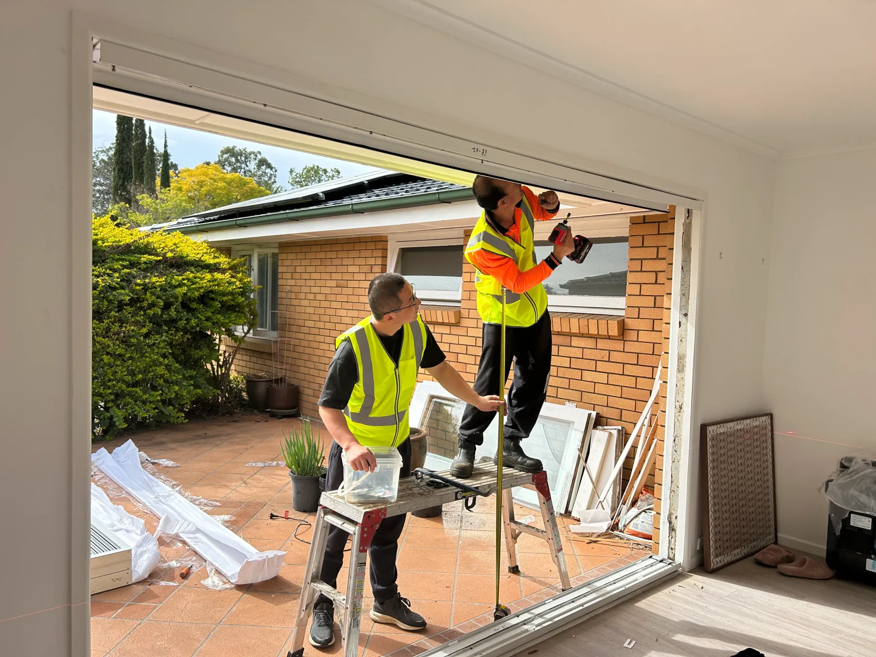 Securing a new double glazed aluminium sliding door frame into the opening in Kenmore QLD